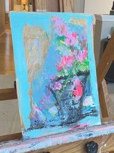 beautiful blue and pink original painting displayed on easel