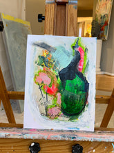 Green abstract flowers and vase on display easel in house by Cheryl Wasilow artist