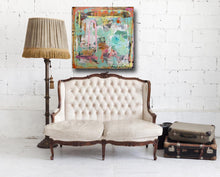 blue, green painting on wall with settee and lamp by cheryl wasilow