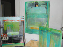 three similar blue paintings setting on floor of art room cherylwasilowart