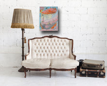 Painting of botanical urn in pastels displayed over sofa