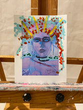 colorful abstract figure of girl with headress on paper setting on easel by cheryl wasilow artist