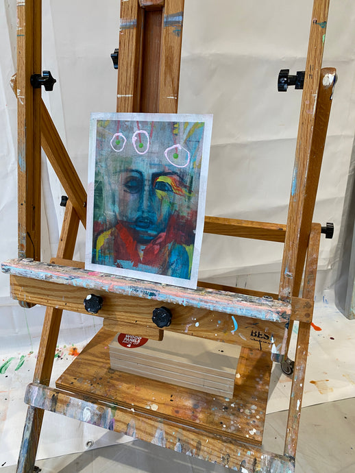 Art easel with a portrait painting on a white background by artist cheryl wasilow