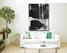 large black abstract painting with sofa by Cheryl Wasilow