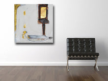 dark brown, white and metallic gold painting on wall beside black chair cherylwasilowart