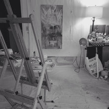 black and white photo of art studio with easel and painting on wall by cheryl wasilow